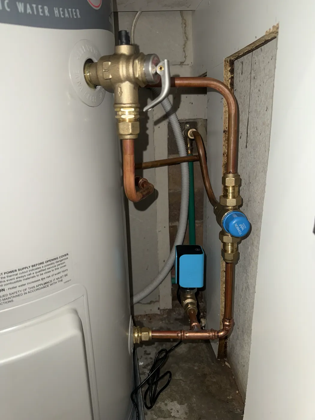 New copper pipework and valves on an electric hot water unit