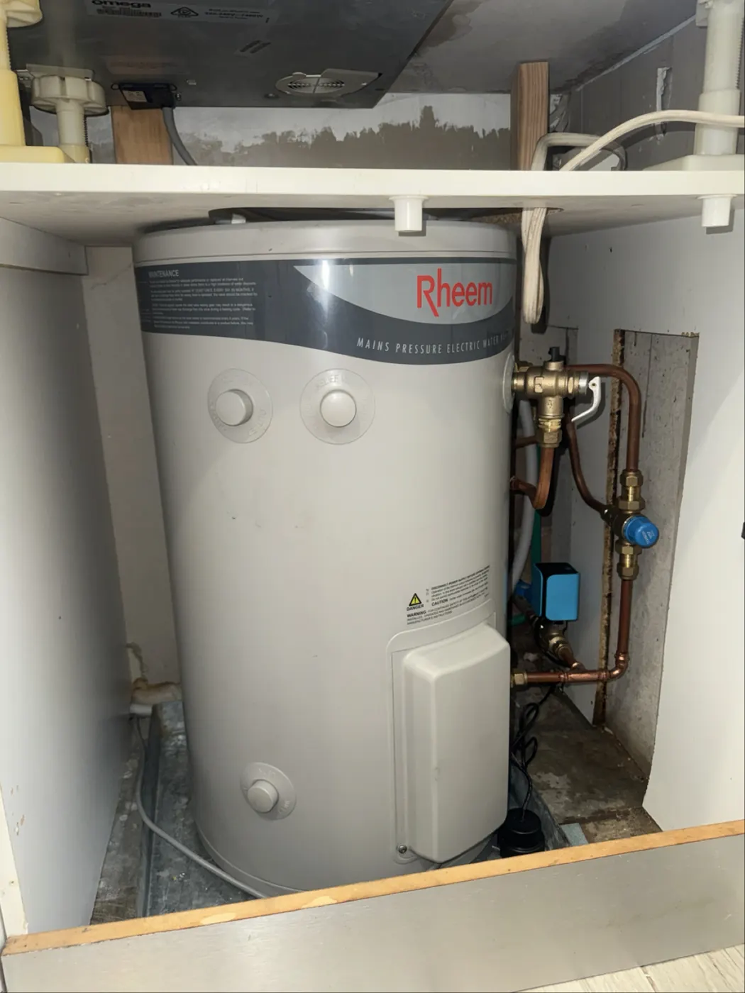 Rheem hot water unit in a cupboard with new connections