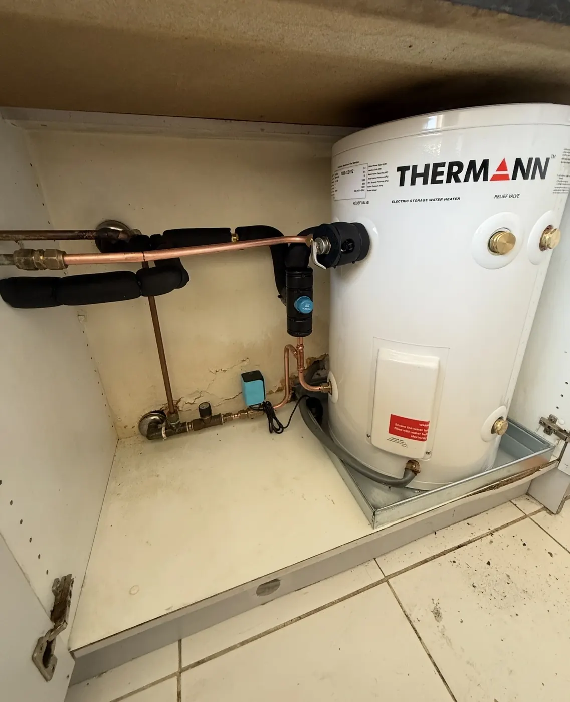 Thermann hot water unit installed under a bench
